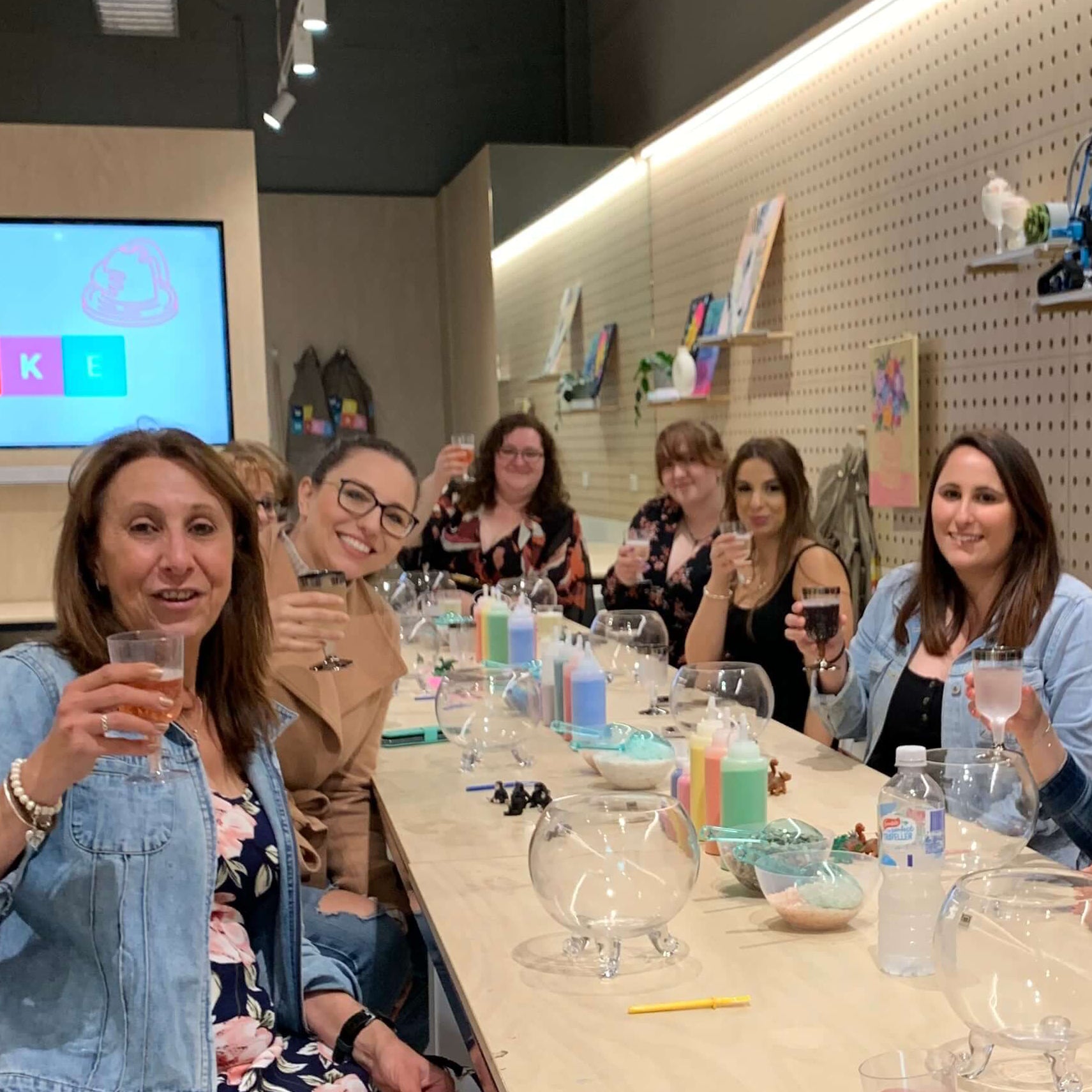 A group of women raising a glass